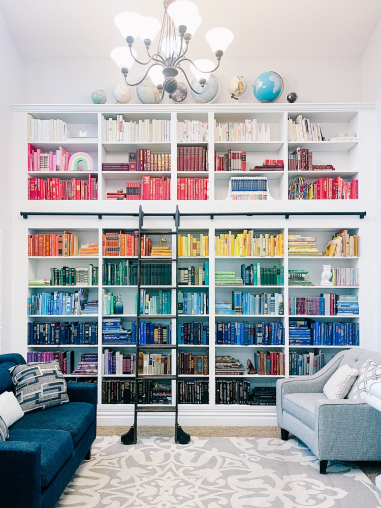 White book cabinet for your colourful book covers in your living room 