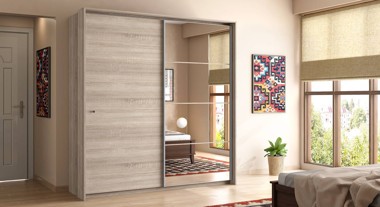brown sliding door wardrobe in a bedroom with a green plant