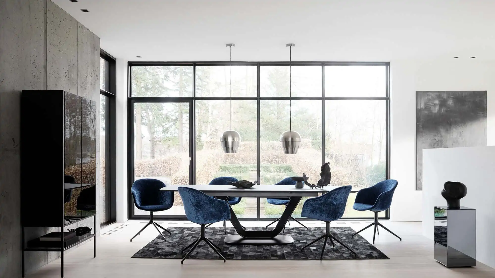 A modern room with black rug, a black cabinet and a black sidetable