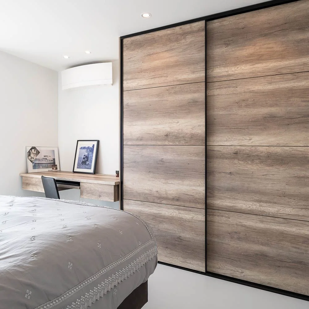 brown wooden cupboard in a bedroom