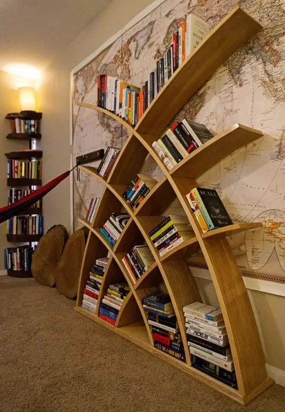 brown curved wooden bookcase, colourful books, room setting