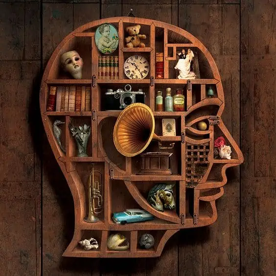 Human face shaped shelf, wall mounted, showpieces arranged, dark wood background