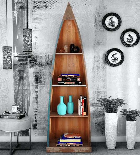 wooden rocket shaped bookcase, study table, articles, vases arranged, gray background
