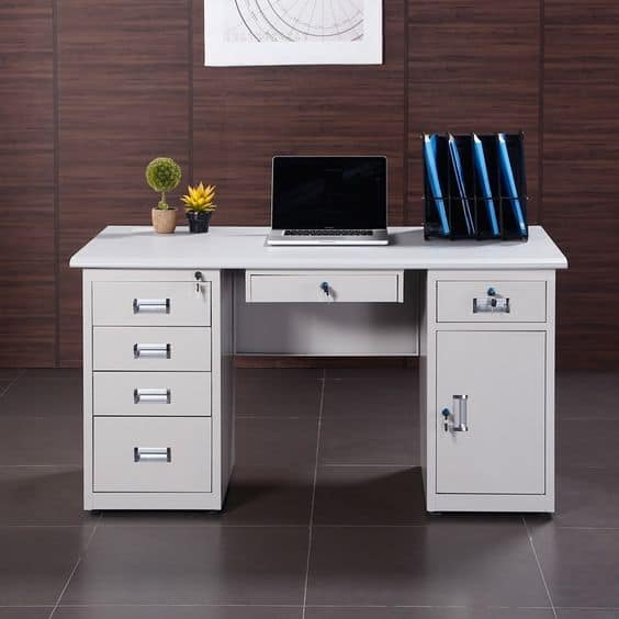 white study table with laptop, drawers and cabinets, small plant, room with dark walls