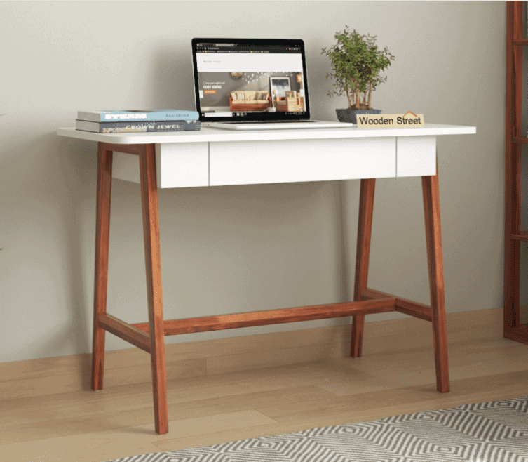off white drawer, brown wooden base furniture, laptop, small plant
