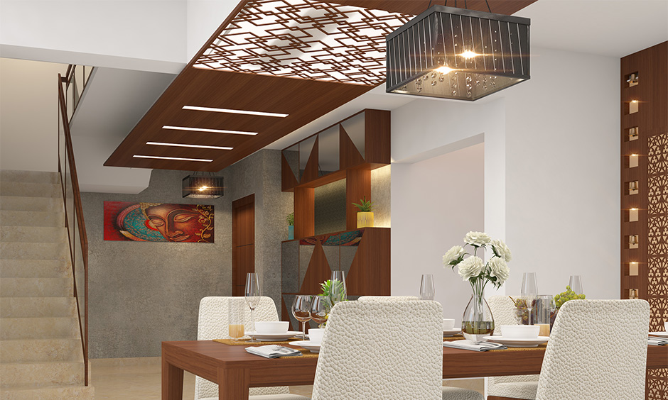 designer ceiling, intricate, wooden, dining room, decorative lighting above, flowers on the table