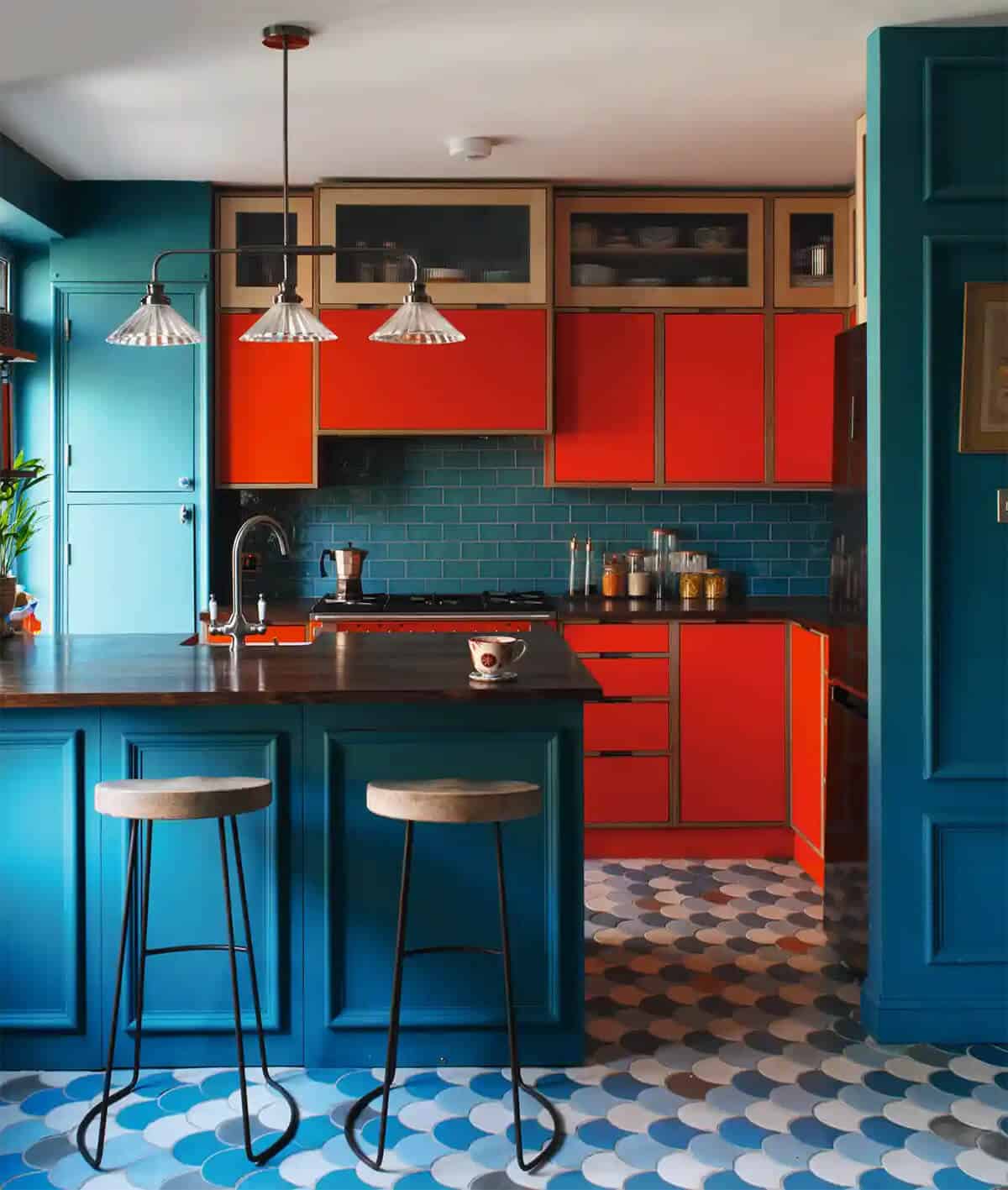 red and blue kitchen design with patterned cabaret floor tiles