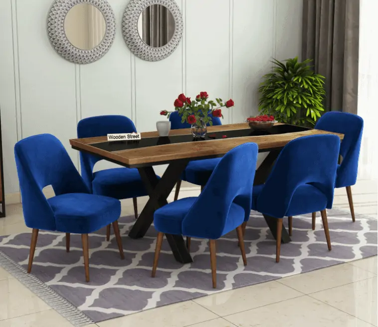 black, brown resin top furniture, blue cushions, brown furniture body, room setting
