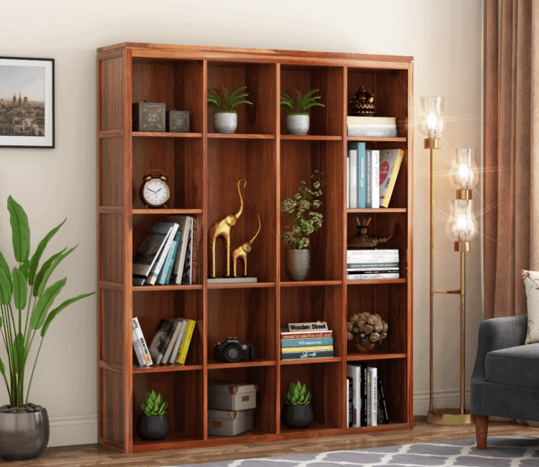 dark honey tall bookshelf with showpieces, articles and books, room setting