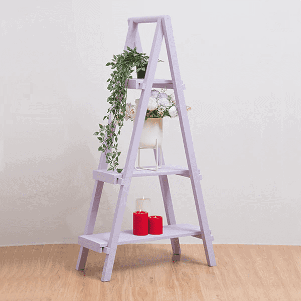 ladder shaped light purple bookshelf with plant