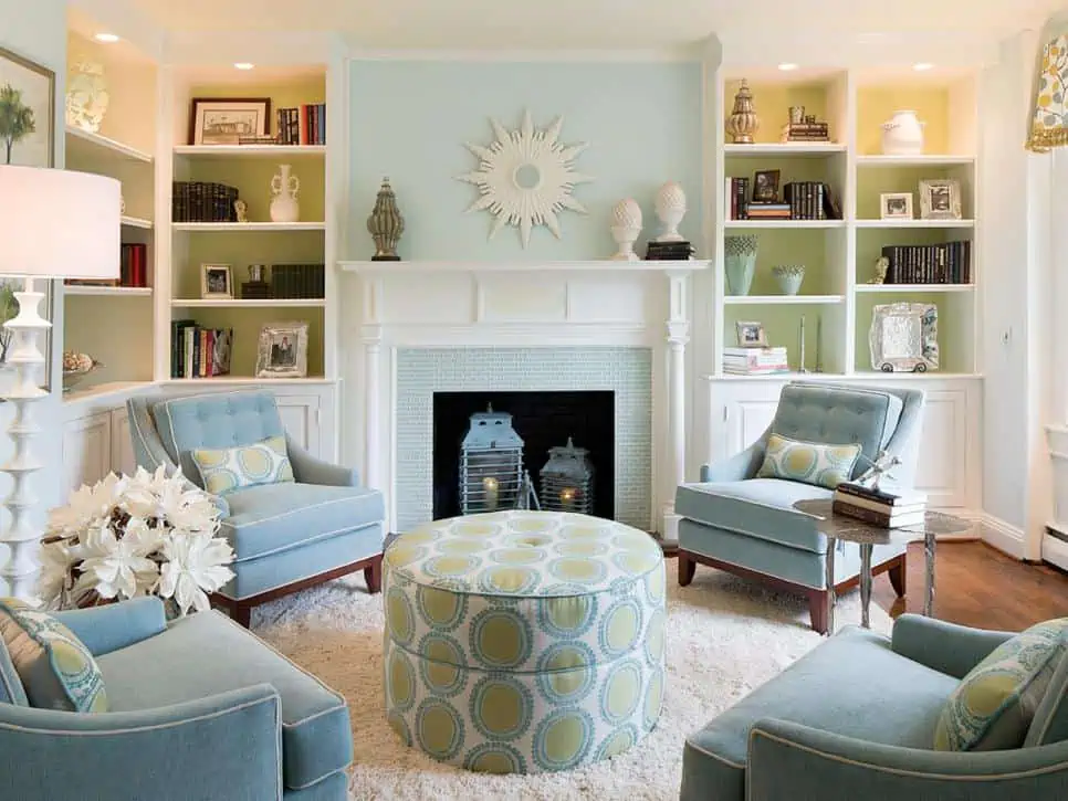 Baby blue, white and green colour analogous scheme for living room with fireplace