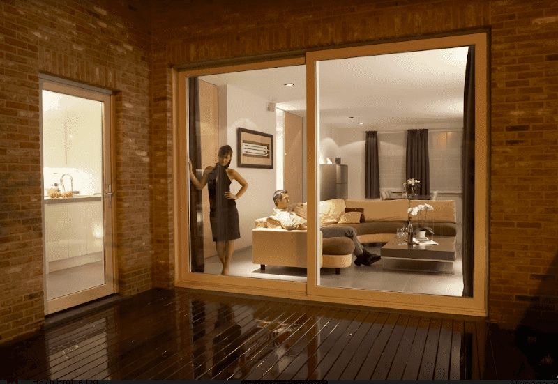 Deceuninck lift and slide doors and windows, transparent sliding door, woman standing, man sitting