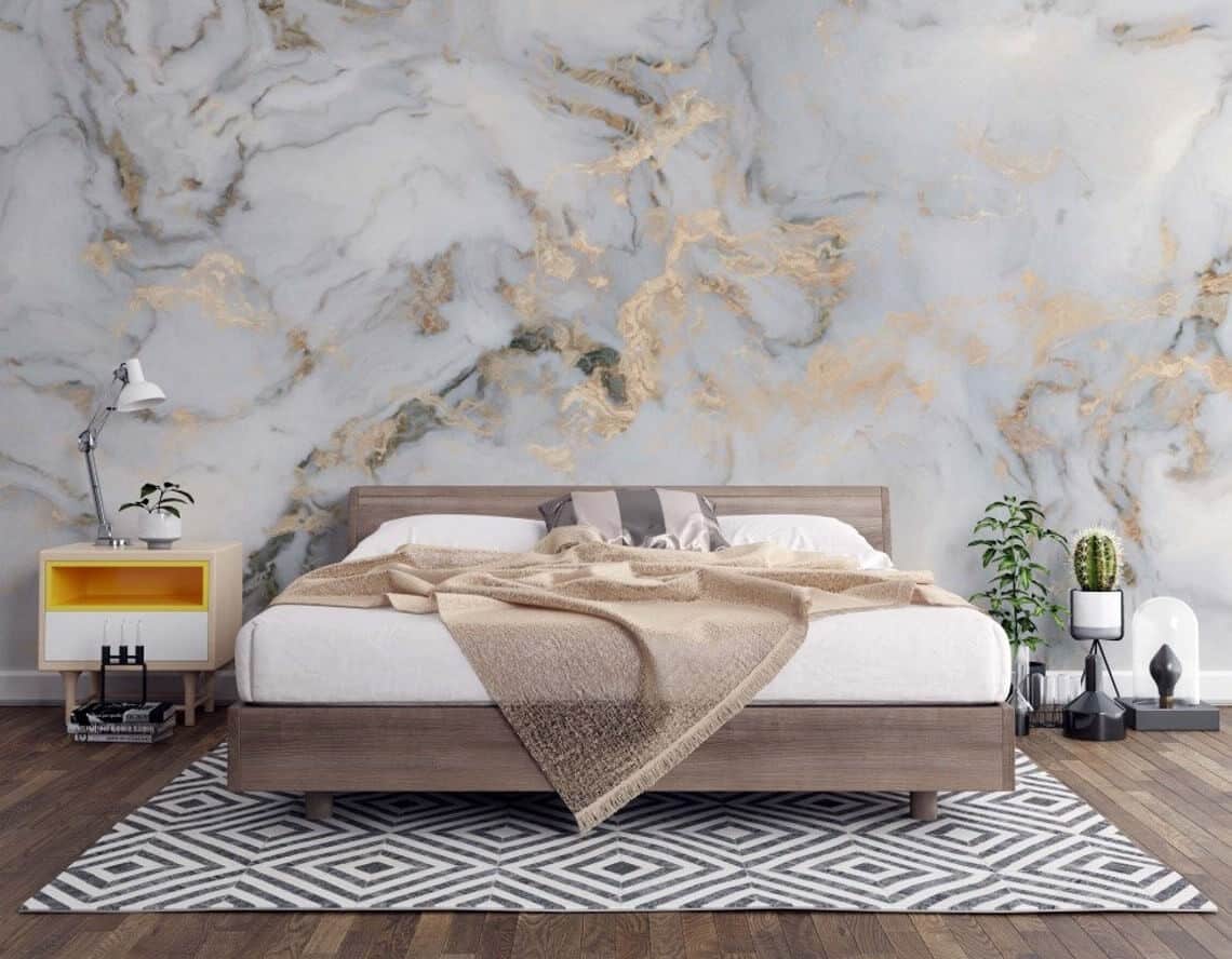 stunning accent wall with wall stickers in a bedroom with white bed and brown wooden floors