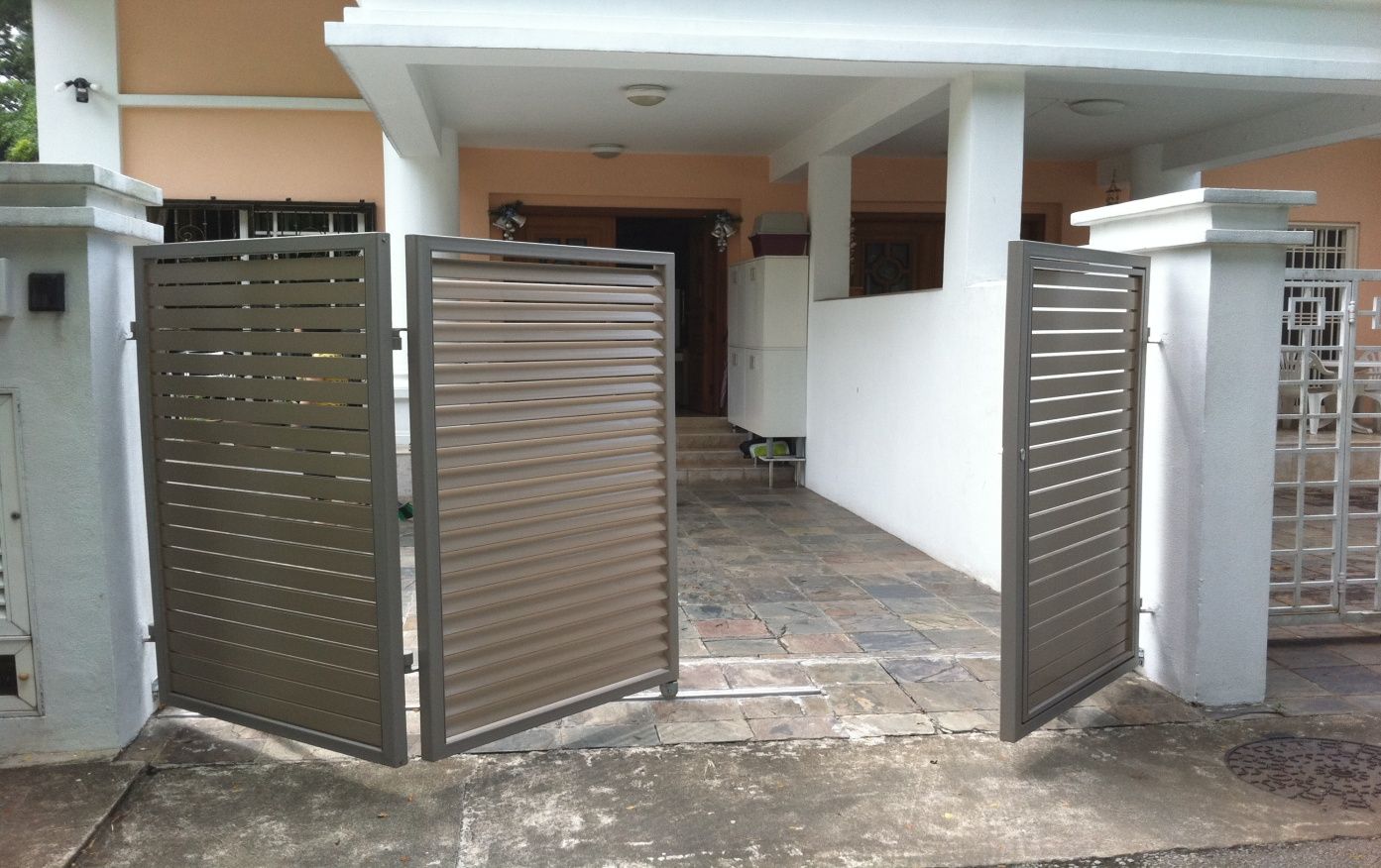 grey folding gate in a white ،use
