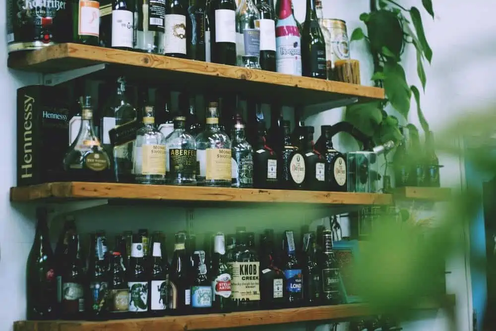 Well stocked home bar with brown shelves