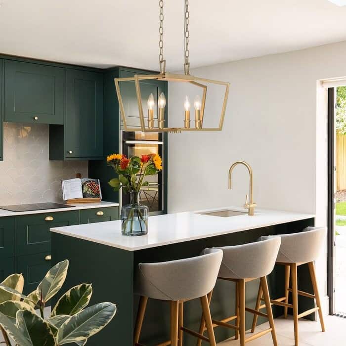 green kitchen interiors with chairs, lamps and indoor plants