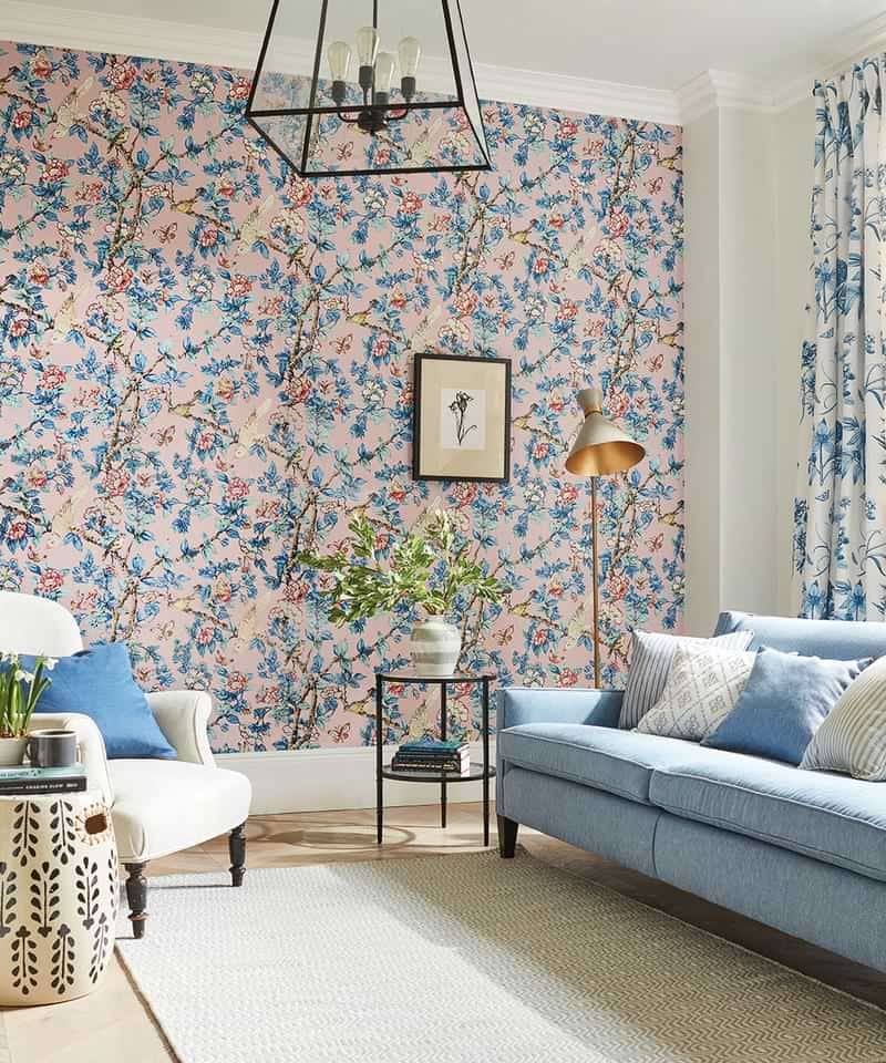 Soft pink colour scheme interior design decoration idea with floral wallpaper for statement wall for small living room 