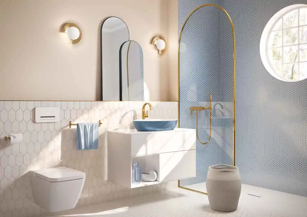twin mirrors in a white bathroom with washbasin, toilet and lamps