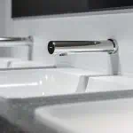 SCHELL MODUS E wall mount tap - affordable automatic sensor tap & draw off fittings for modern washbasin in chrome finish