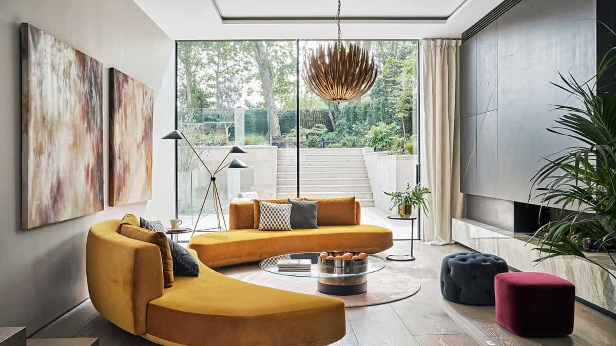 Living room with modern golden pendant light for drama and yellow sofa set