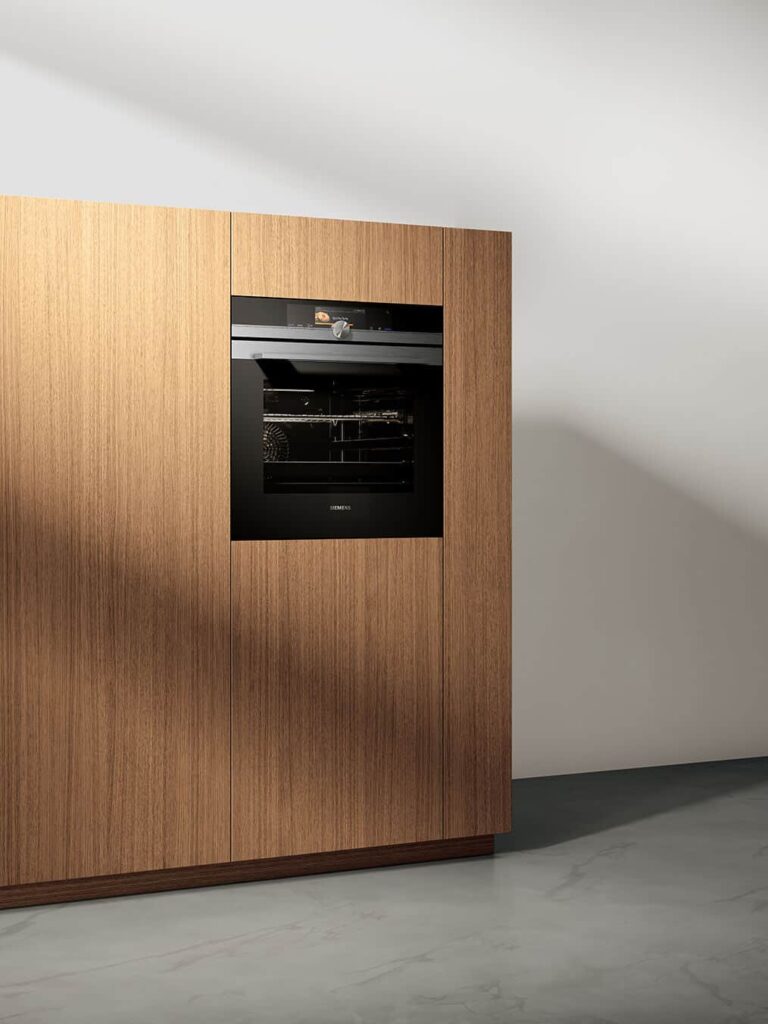 combination steam oven flushed into brown cabinetry