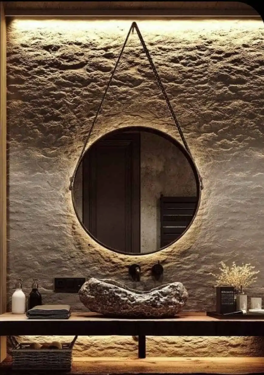 modern stone washbasin design with an attractive mirror and cabinet in hall