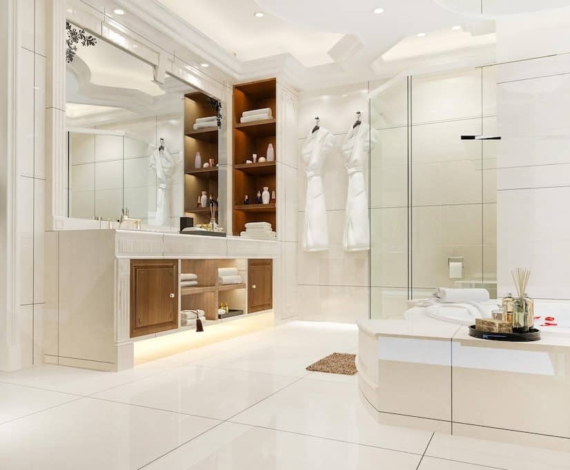 immaculate white marble bathroom with mirror and bath tub