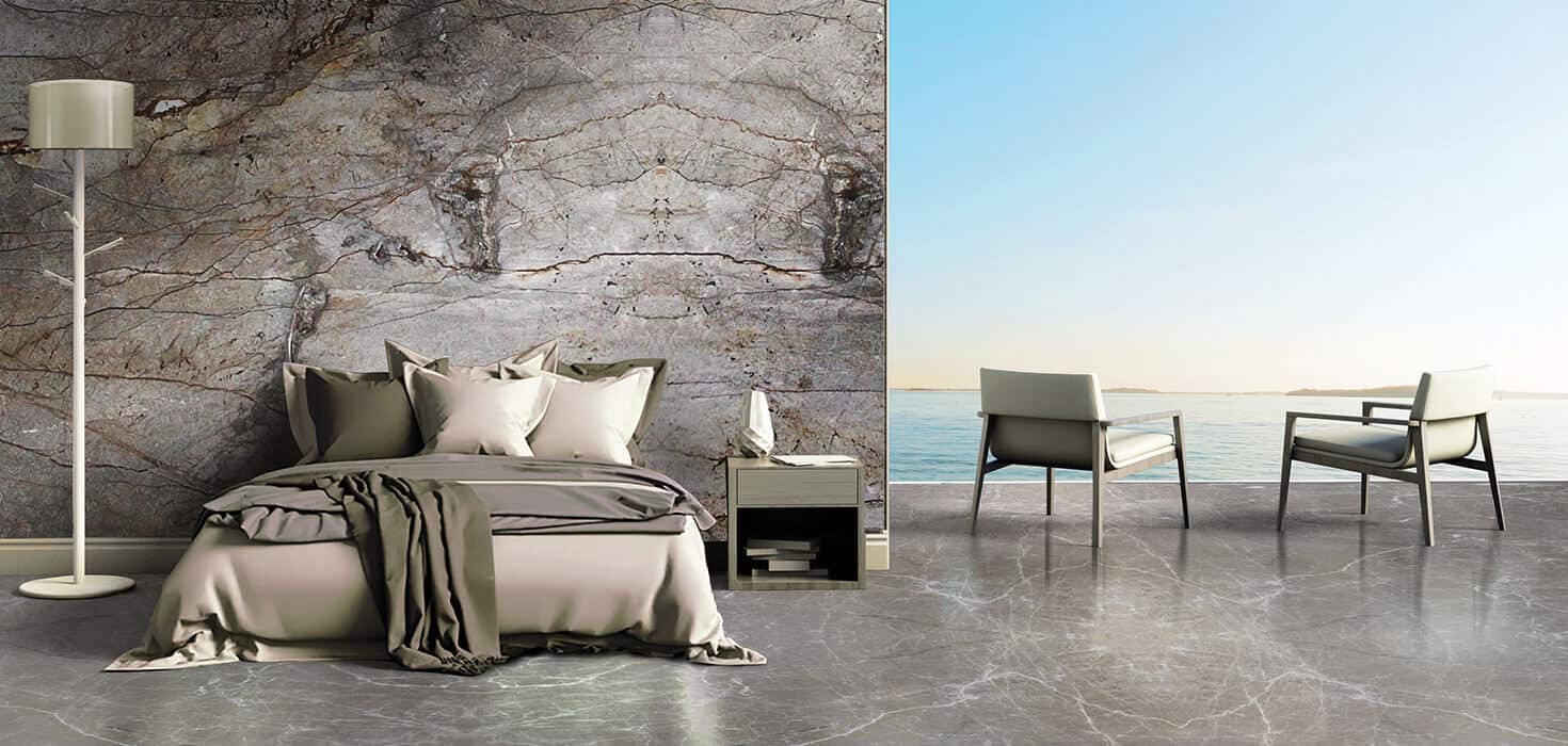 bedroom with grey marble wall and a bed and design in marble flooring