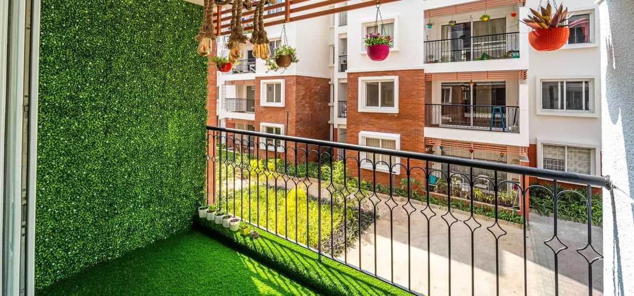 Green balcony with faux grass carpeting on floor and walls simple decoration ideas