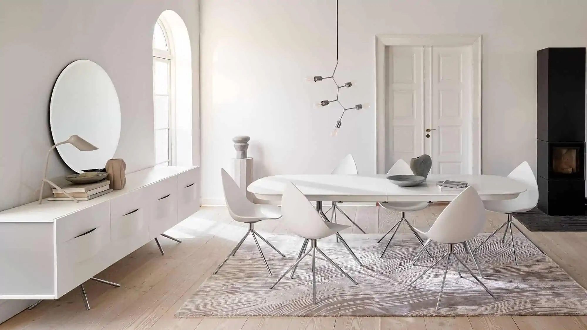 stunning livingroom with beige rug and white furniture