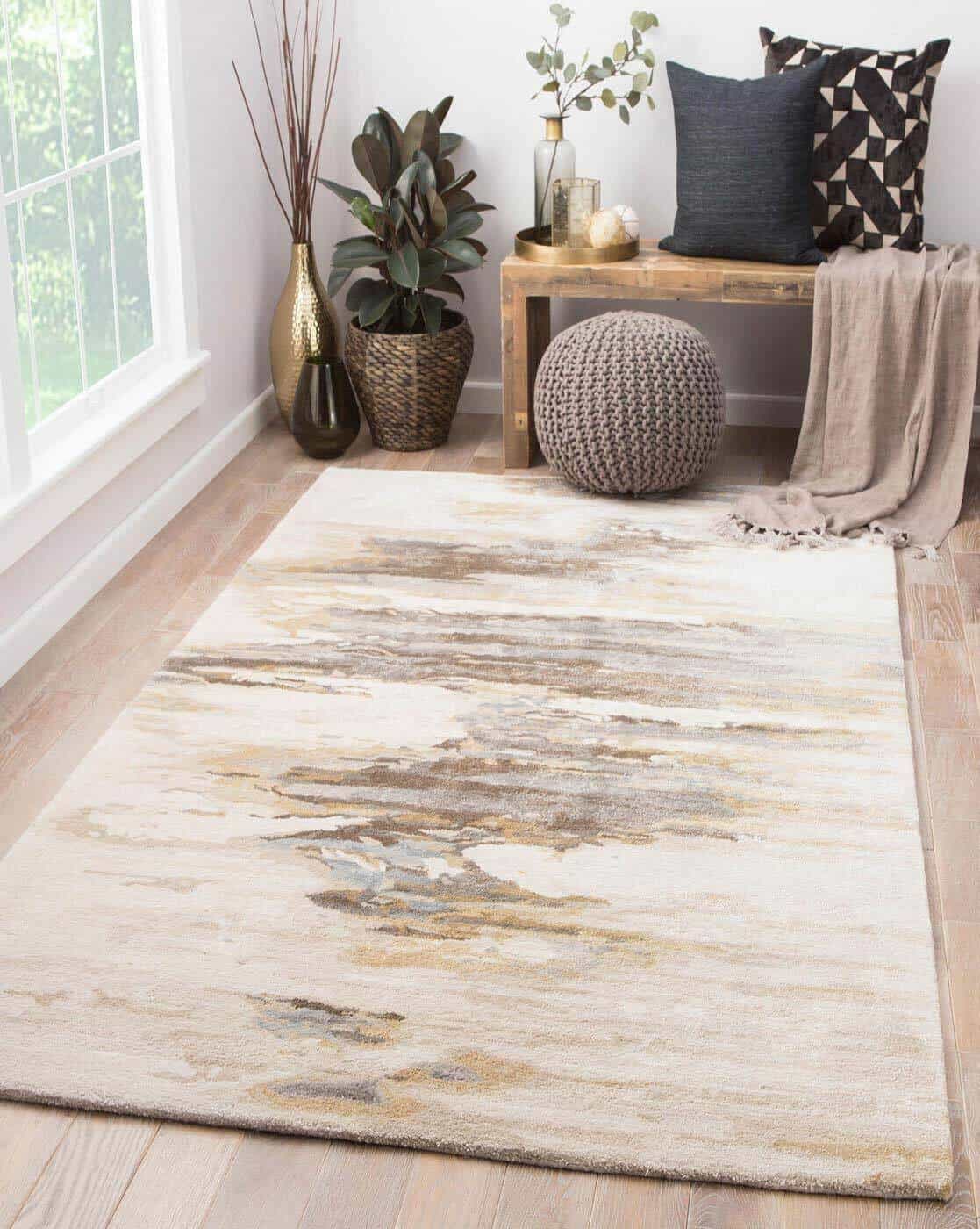 beige hand tufted rug with wooden furniture