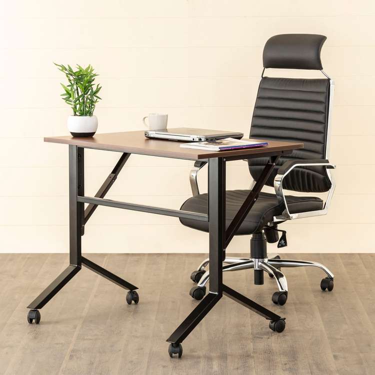 office desk with laptop, office chair, indoor plant, folding furniture