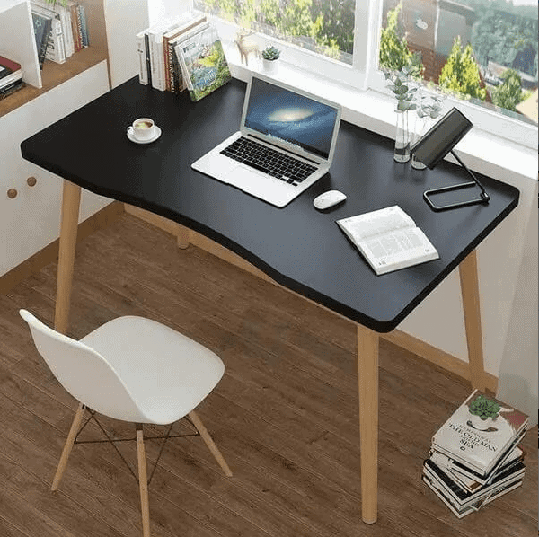 black top table, wooden legs, white chair, laptop