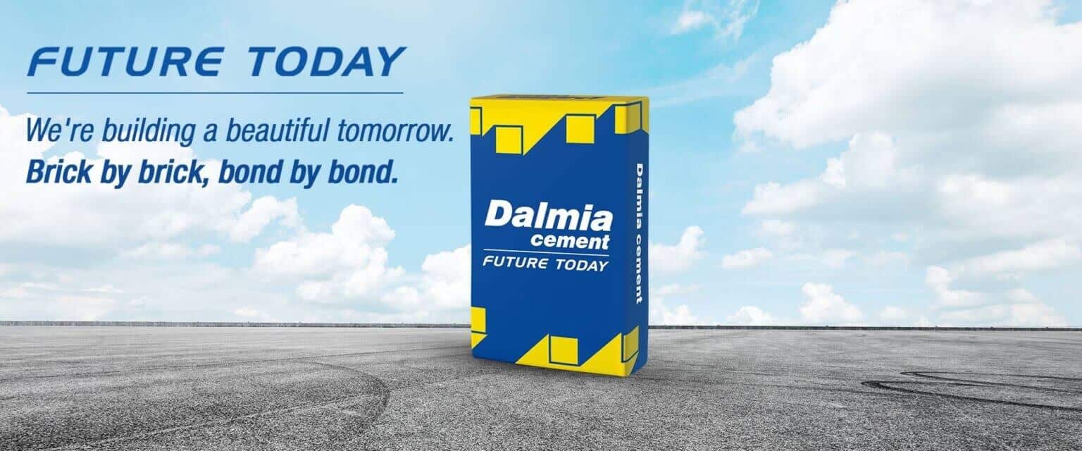 dalmia cement pack set against a blue sky and gray concrete