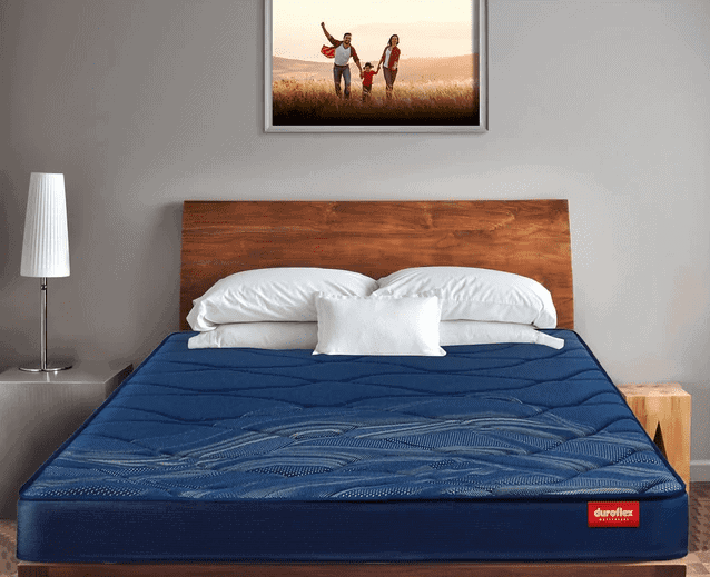 wall hanging, bedroom, dark blue mattress from good mattress ،nd, white pillows, bed