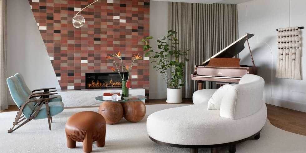 white living room with piano, fireplace and contemporary seatings