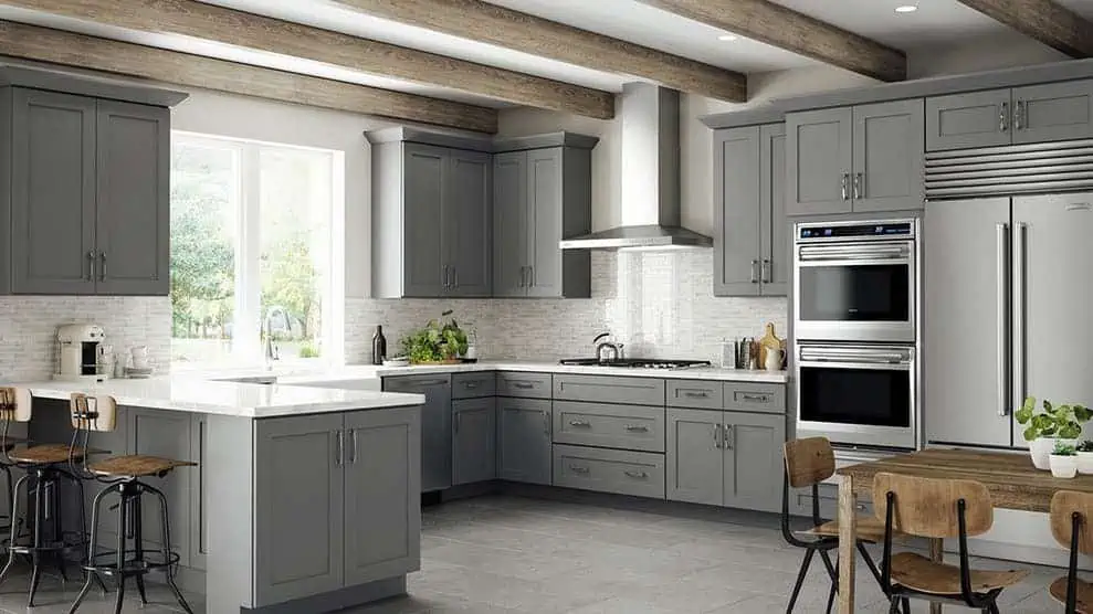 modern kitchen with a dining table, chimney and chairs in grey interiors