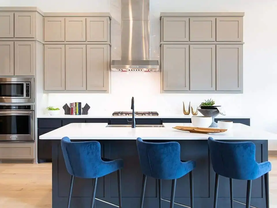 blue accent chairs in a minimalistic kitchen