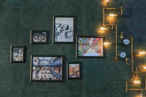 stunning wall decoration with pictures and bulbs on a green wall ideas for wall decoration in living room