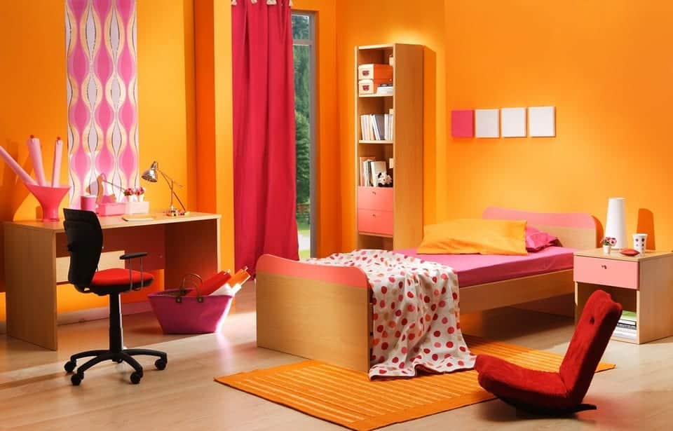 orange bedroom colour with red curtains and bed