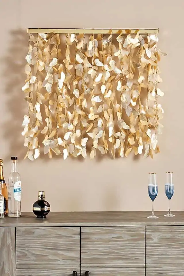 DIY paper crafts wall decoration ideas for living room or bedroom in golden colour with wine glasses and a cabinet