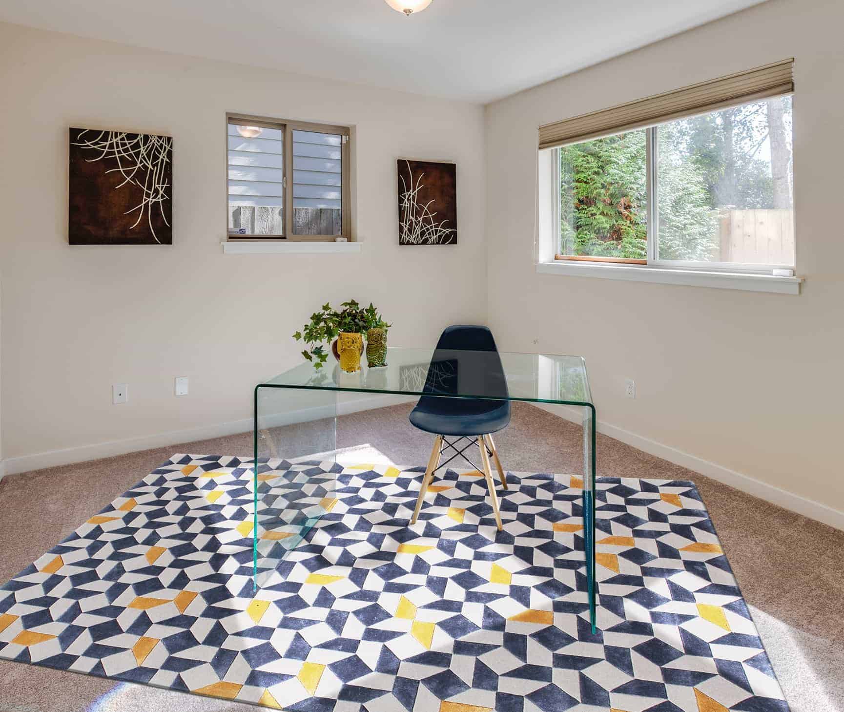 geometric pattern type carpet in living room with a black chair