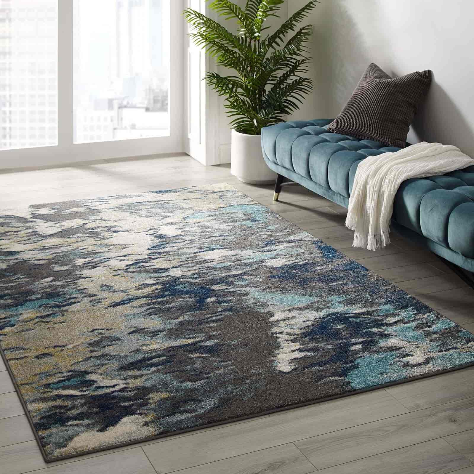 subdued black, white and blue rugs in a room