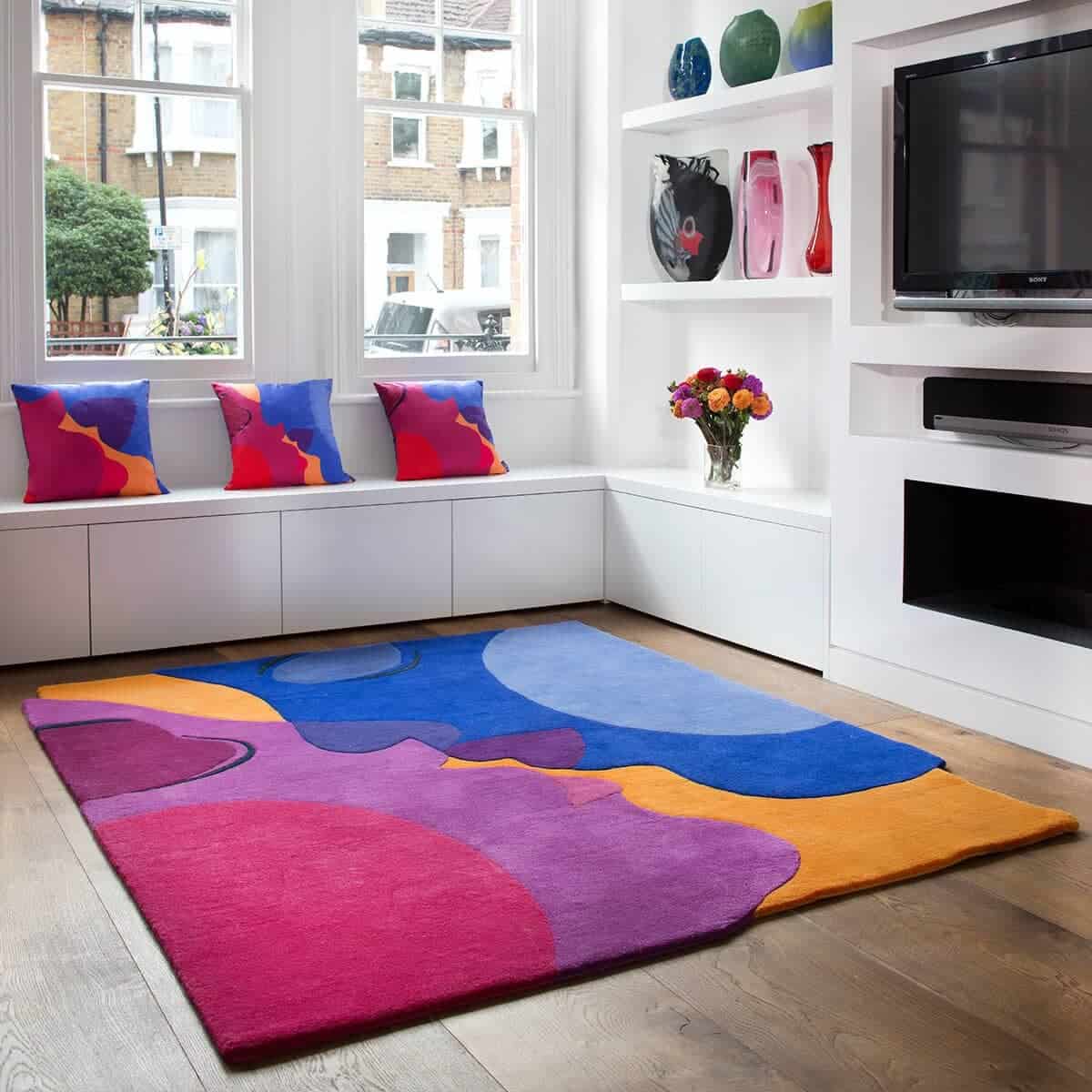 multicolored rug with red, blue and orange hues