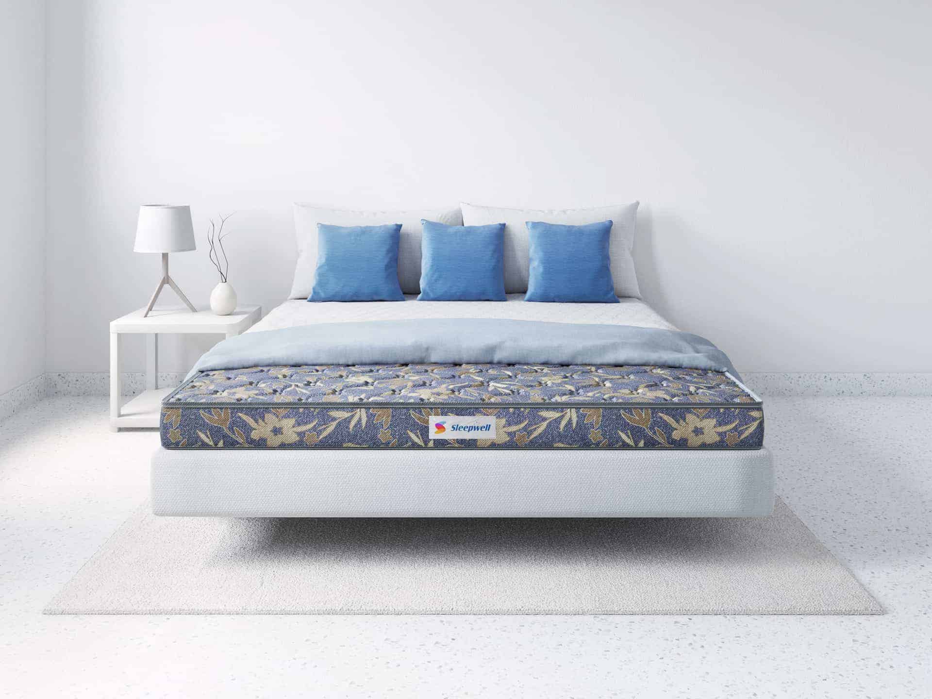 bed, blue coloured mattress, blue cushions, bedroom