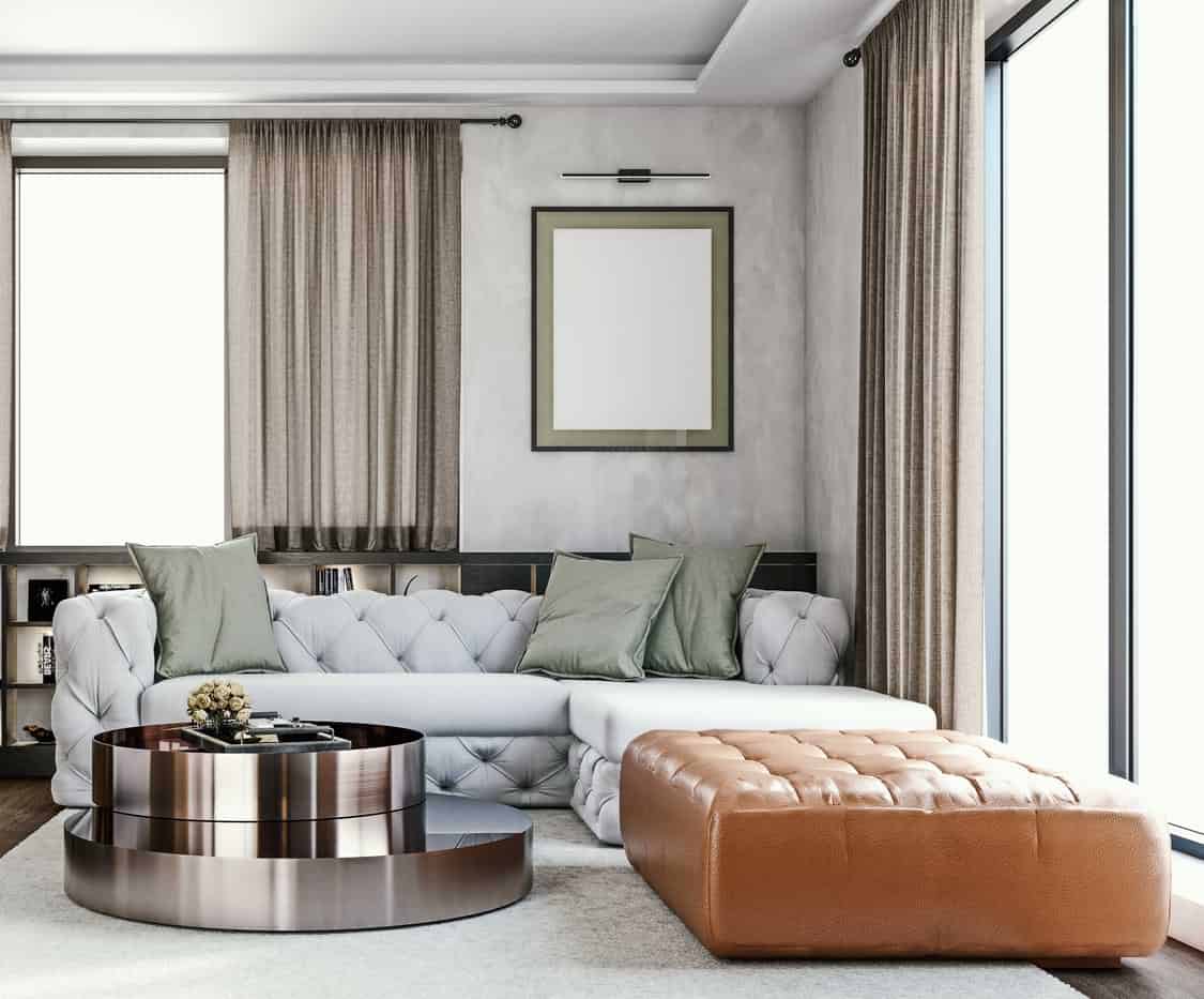 Unique coffee table design in polished metal in white room