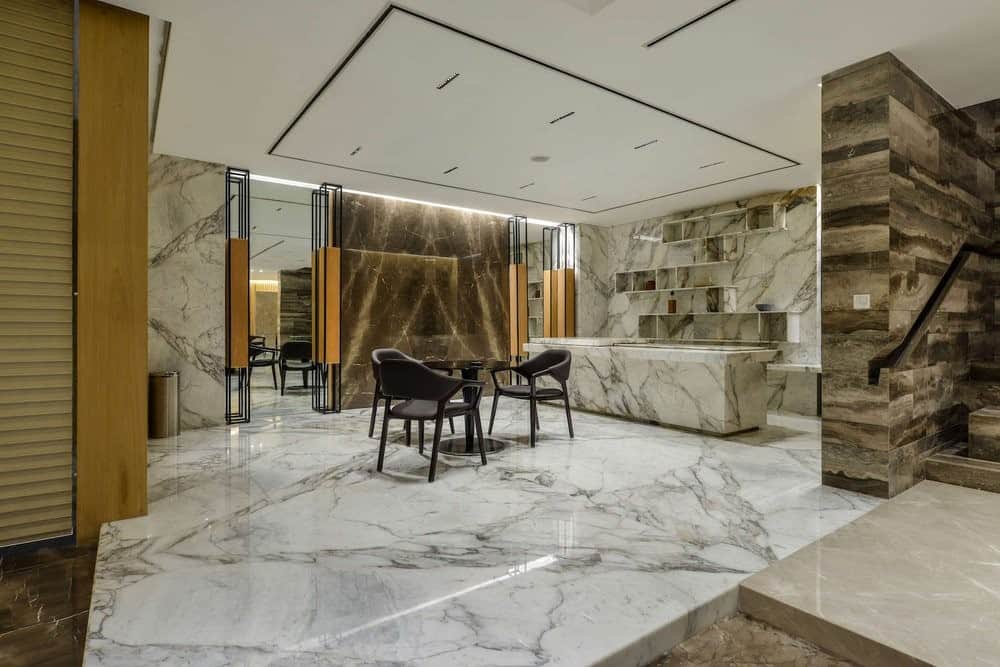 beautiful living room with white Italian marble counters, floors and design flooring