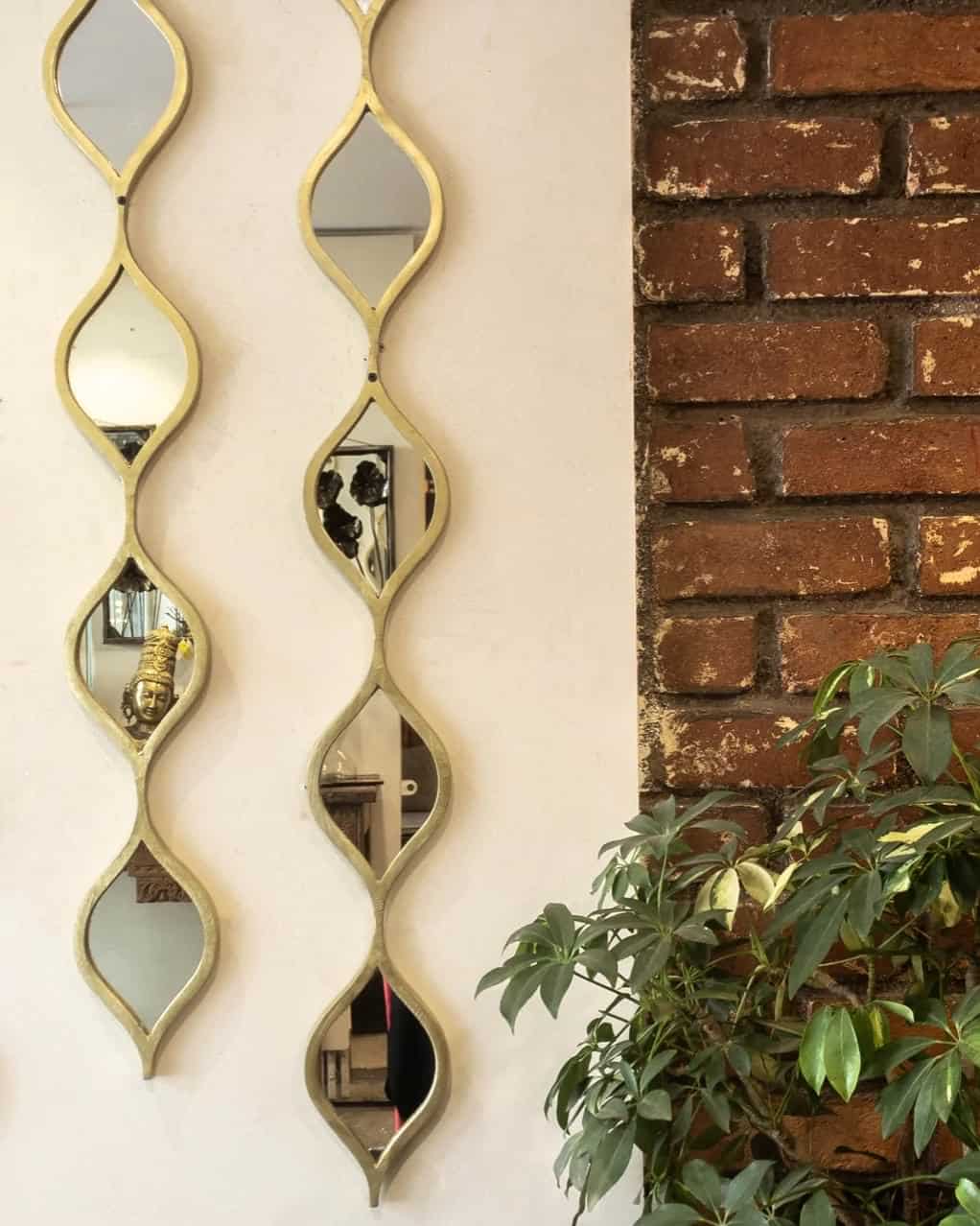 wave pattern wall hanging with mirrors and golden rims