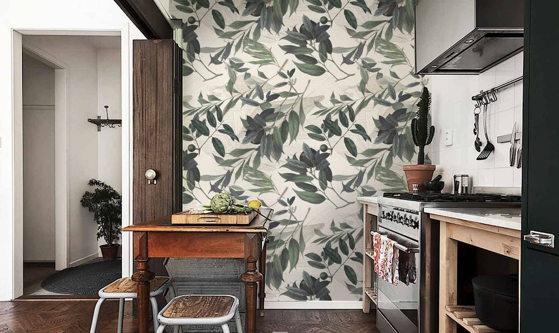green tropical wallpaper in a kitchen with a brown table and cabinet