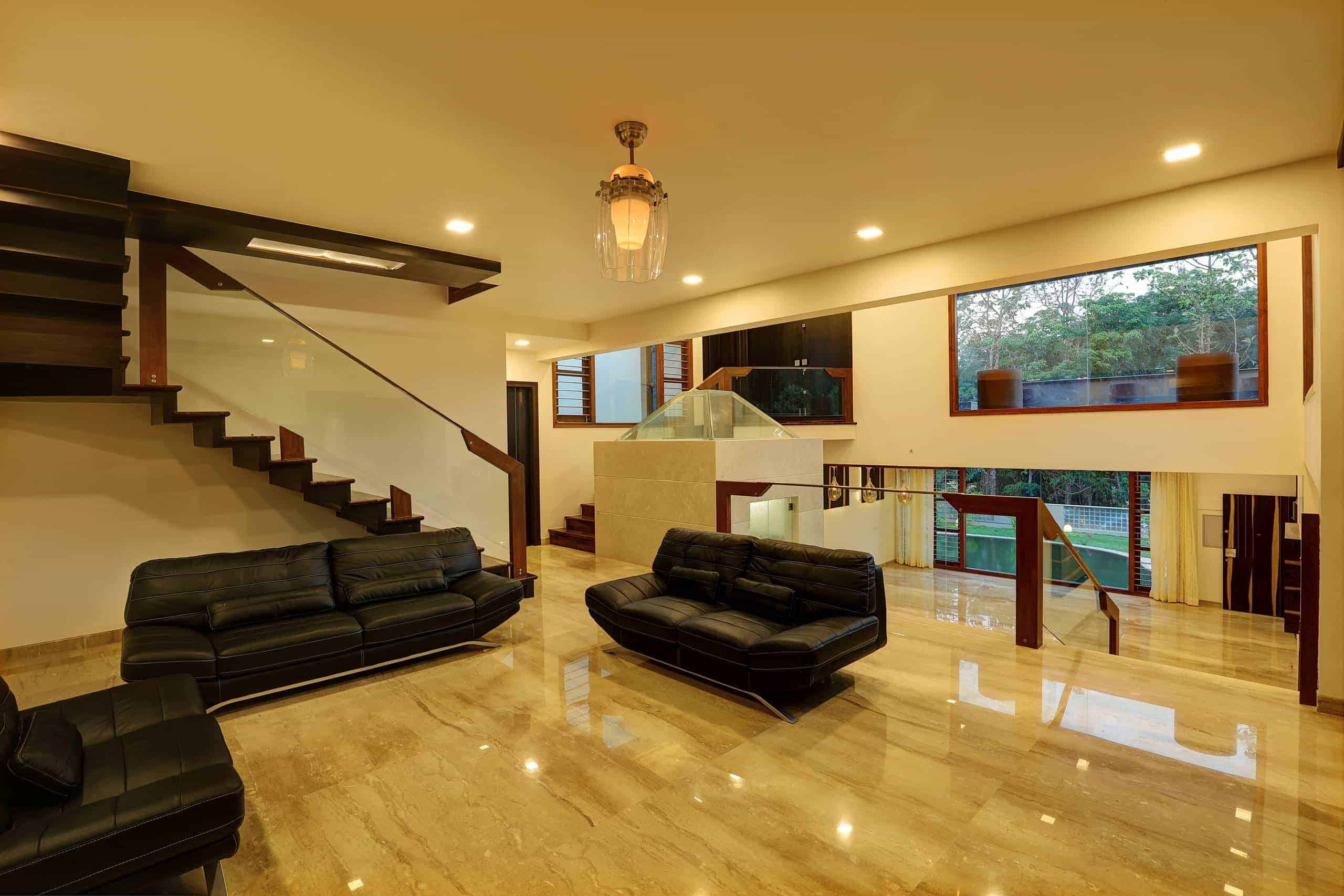 stunning floors and black sofas in office hallway